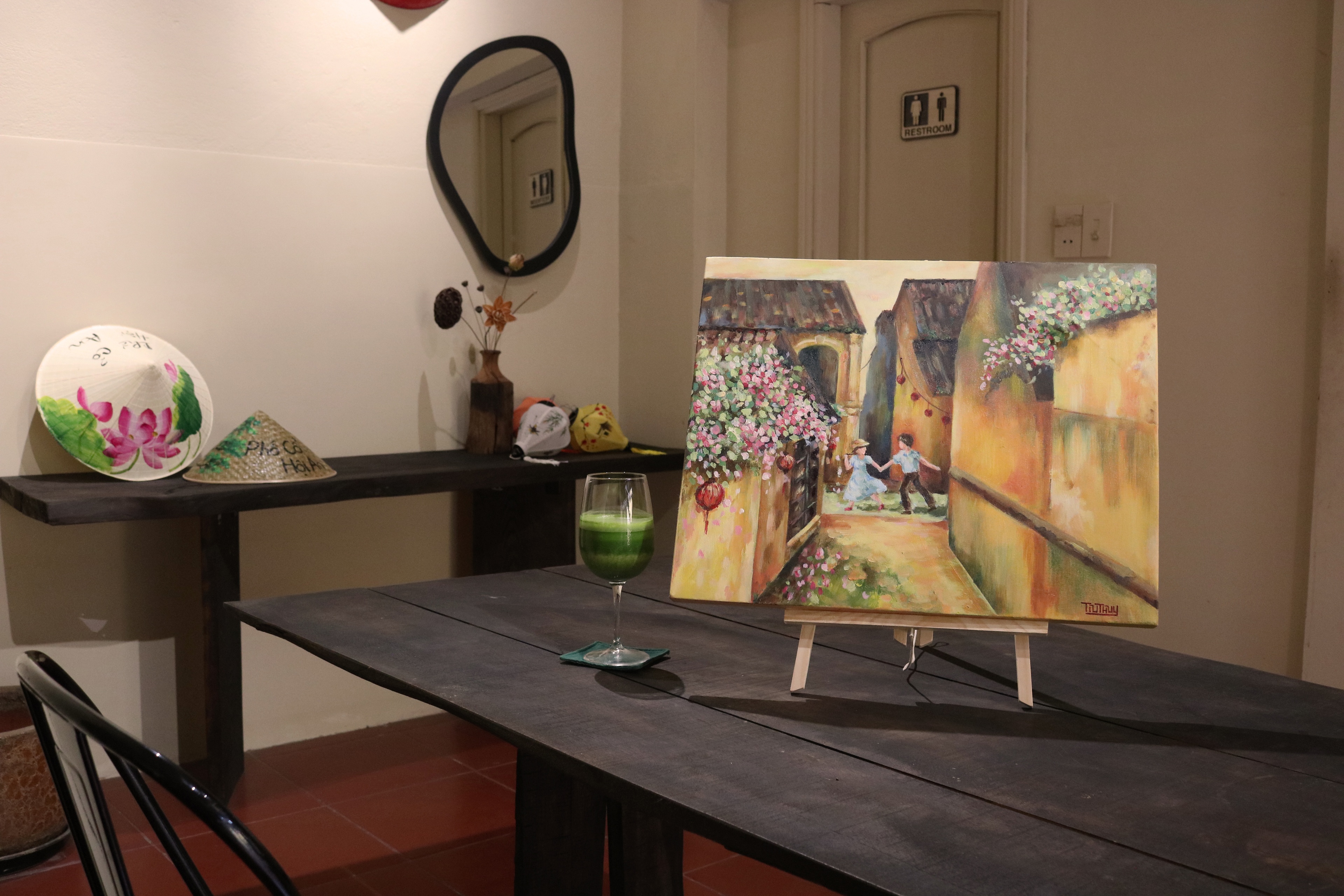 Inside the Faifo Art studio, finished canvases on display